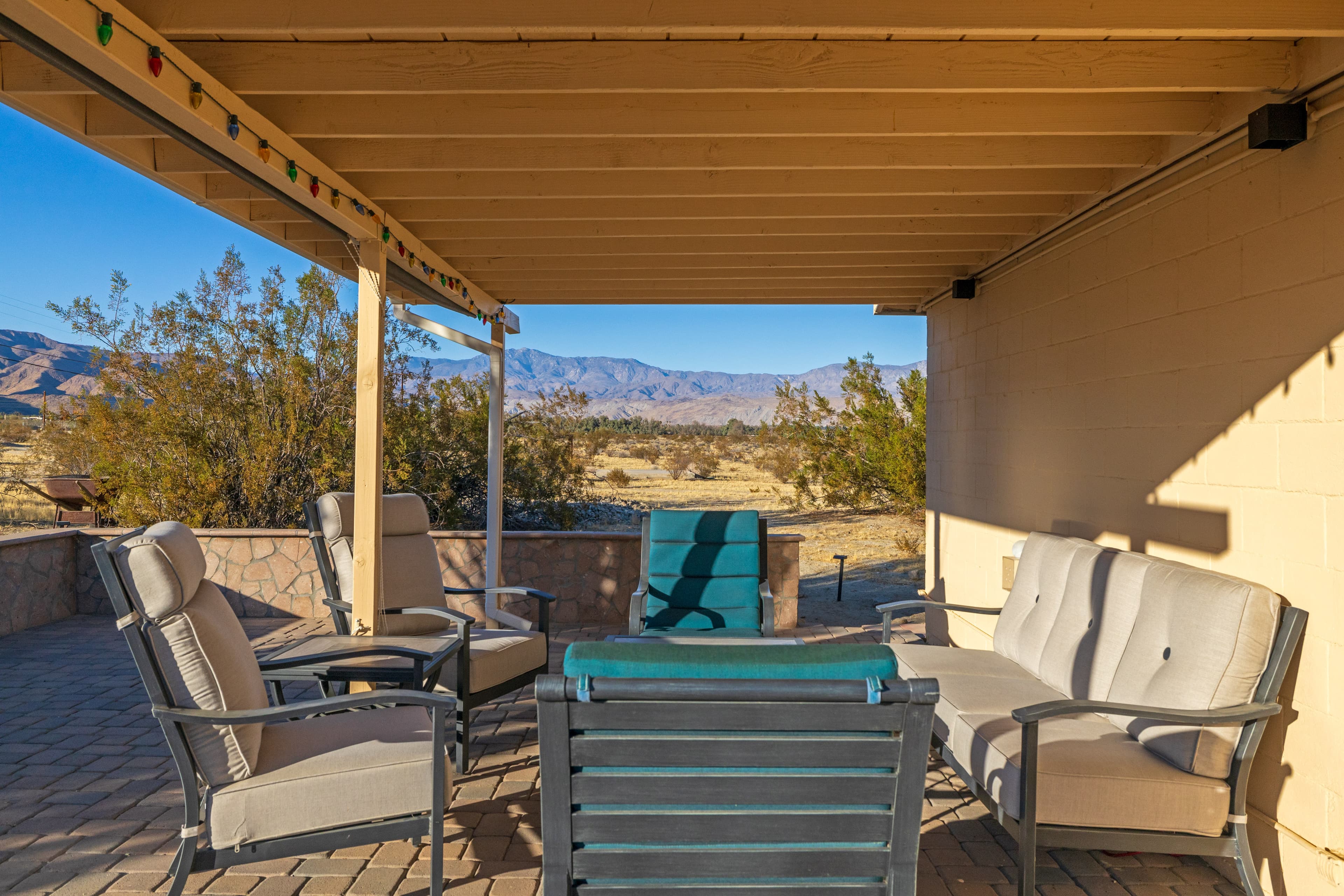 Covered patio overlooking north and west mountain ranges